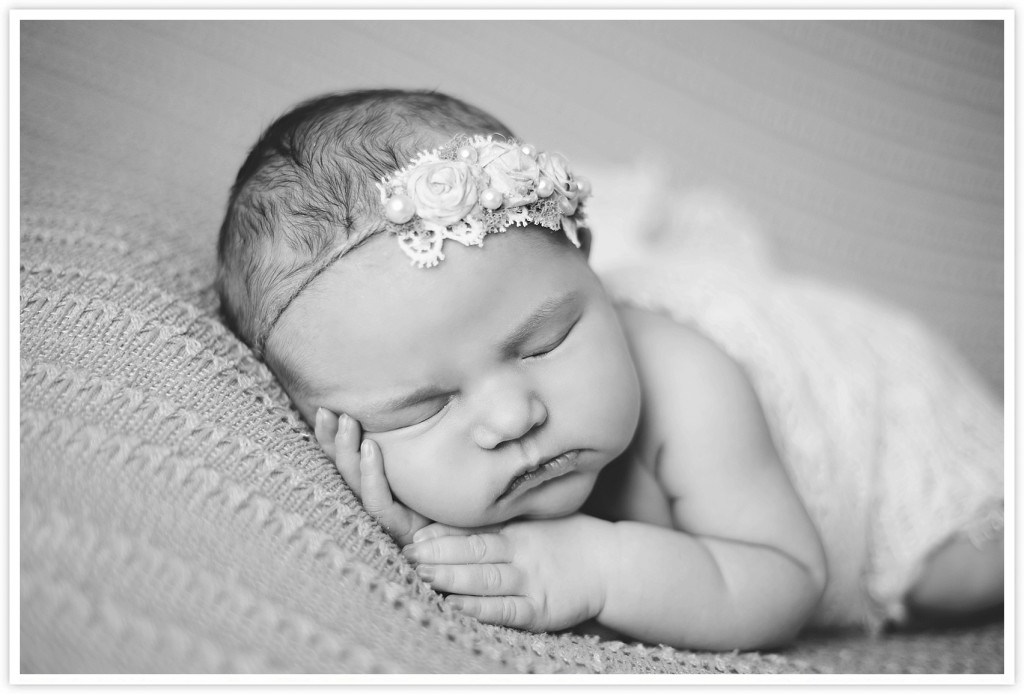 black and white sleeping newborn baby photo