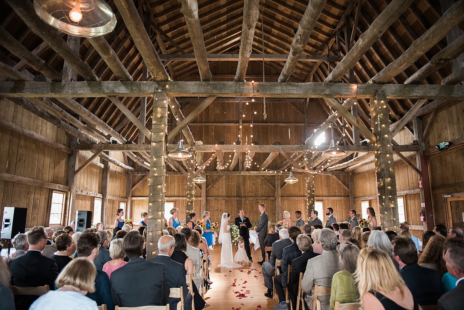 Traverse City Wedding Venues: Indoor wedding ceremony at Traverse City Wedding Barn, also called the Garvey Barn, in Northern Michigan