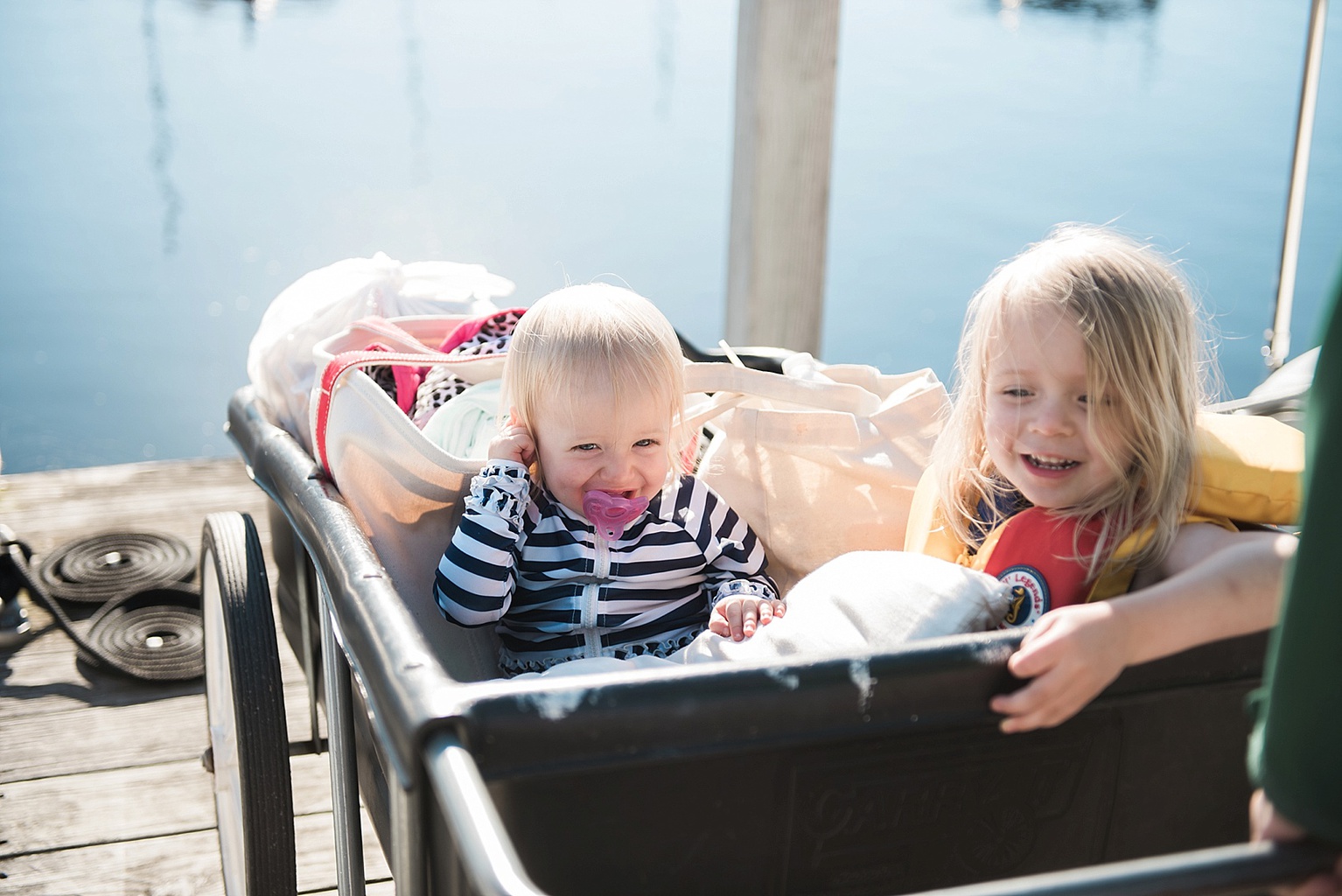 the girls in a cart at Great Lakes marina