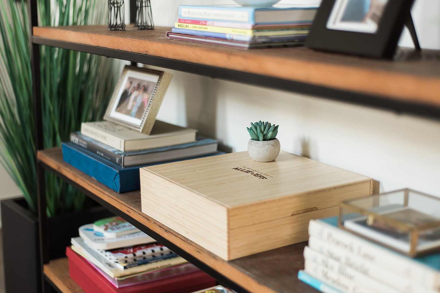 bamboo album box on a bookshelf