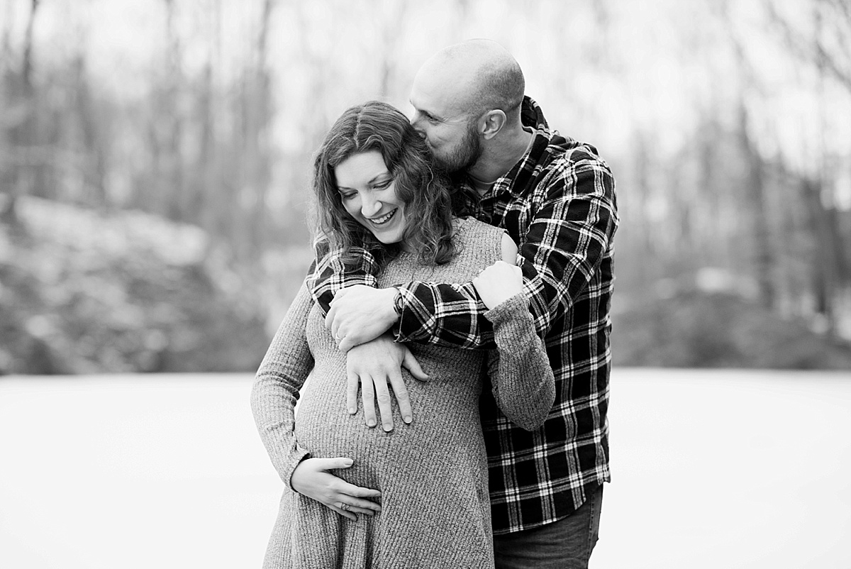 Lansing winter maternity photos by a winter pond