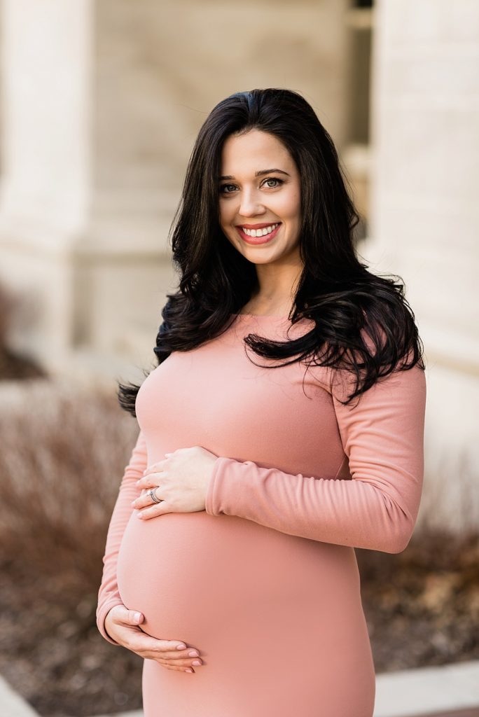 Close up of long dress winter maternity photos in East Lansing, Michigan