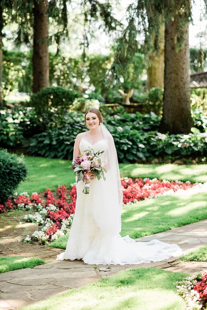Bridal portraits in the gardens of The English Inn, a Lansing wedding venue