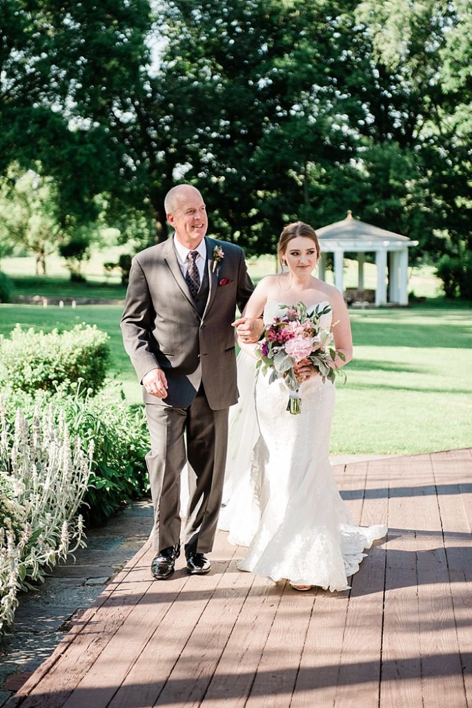 Bride walking down the aisle at The English Inn, by Allie & Co. Lansing wedding photographers
