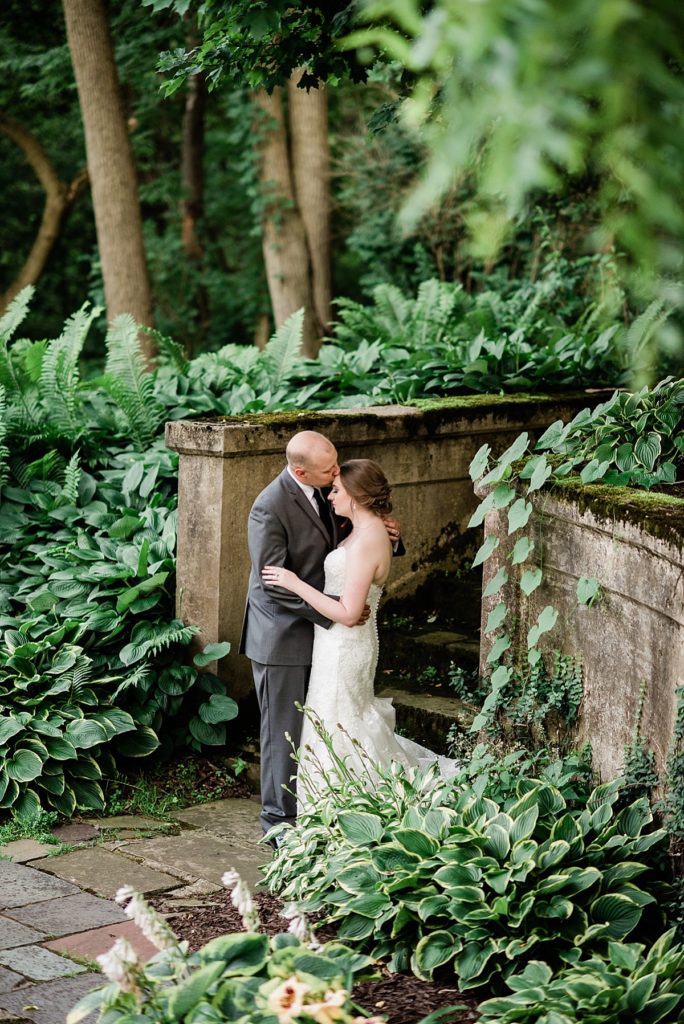 bride and groom photos with greenery and vines at The English Inn, by Allie & Co. Lansing wedding photography