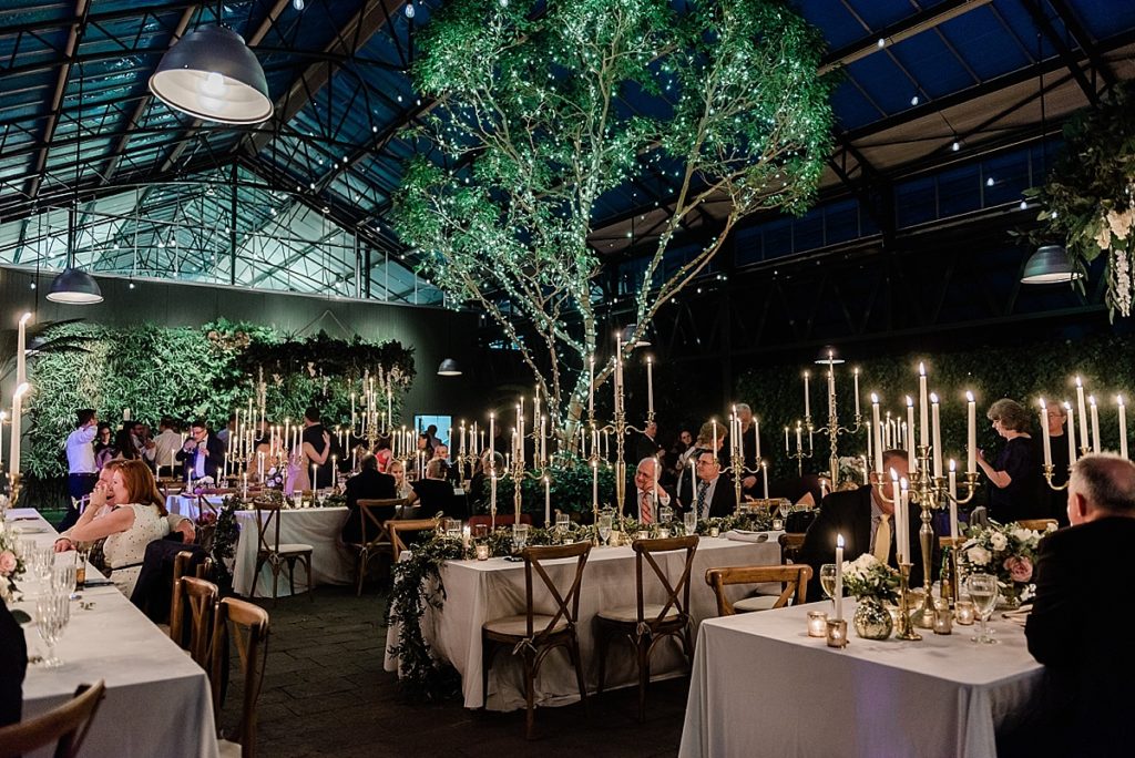 nighttime dinner setup at Planterra Conservatory, Wedding Photos in West Bloomfield, Michigan, by Allie & Co. wedding photographers