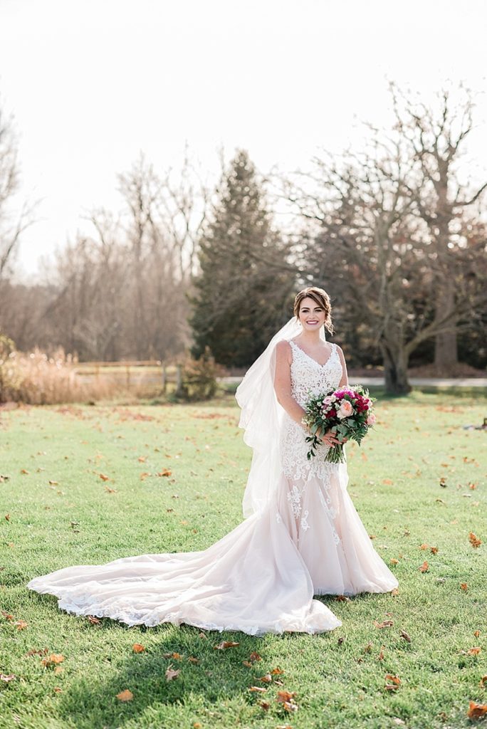 A photo of the bride during a late fall outdoor wedding at Stone House Farm, a Michigan barn wedding venue
