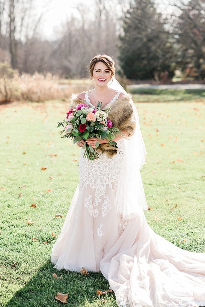 A photo of the bride during a late fall outdoor wedding at Stone House Farm, a Michigan barn wedding venue