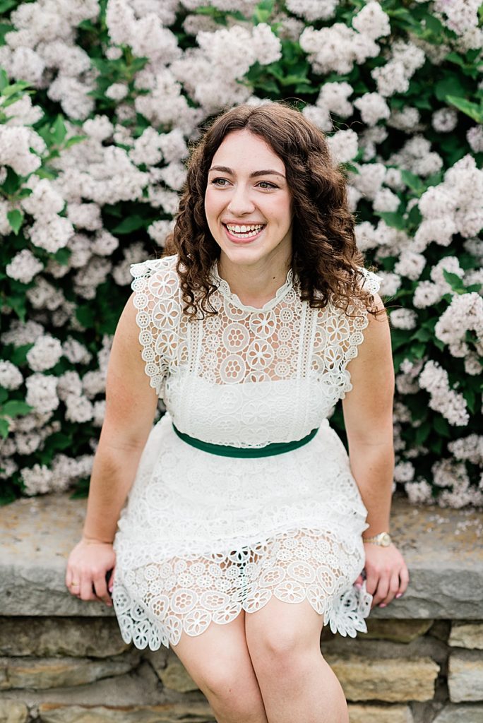 Michigan State University (MSU) senior portraits in a white dress in front of Spring flowers East Lansing, Michigan - by Allie Siarto Photography, Michigan photographers