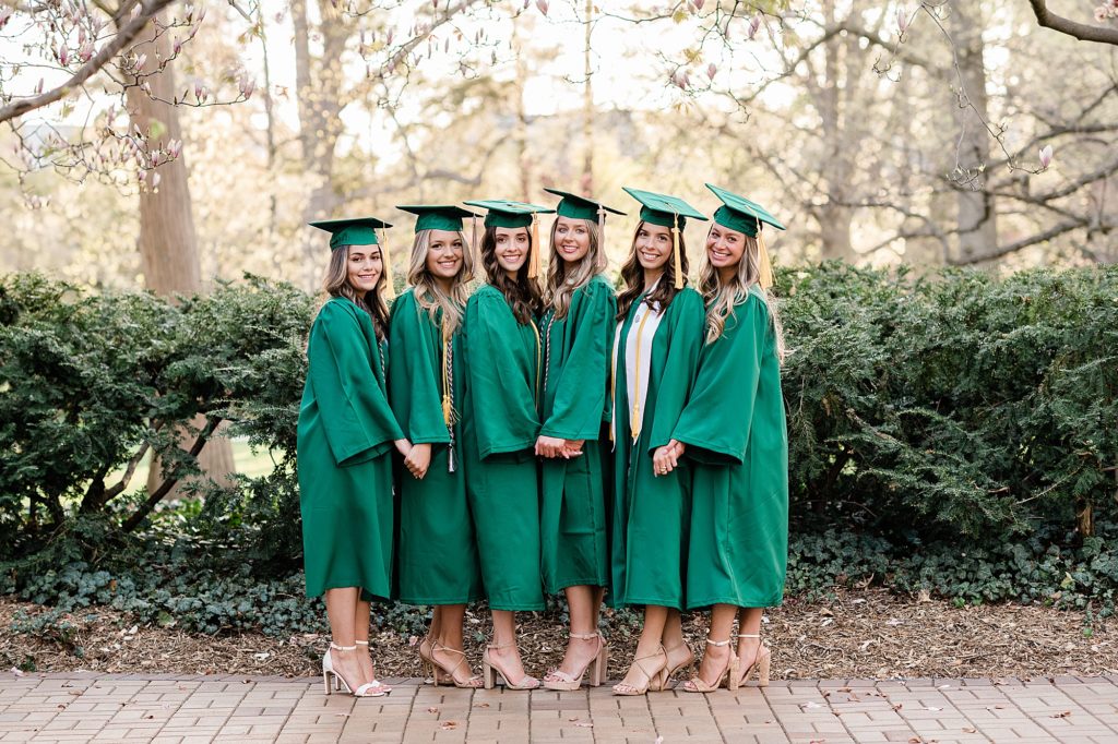 Michigan State University senior photography ideas with roommates on campus in white dresses and cap and gown near Beaumont Tower, by Allie Siarto & Co, senior photographers in East Lansing, Michigan