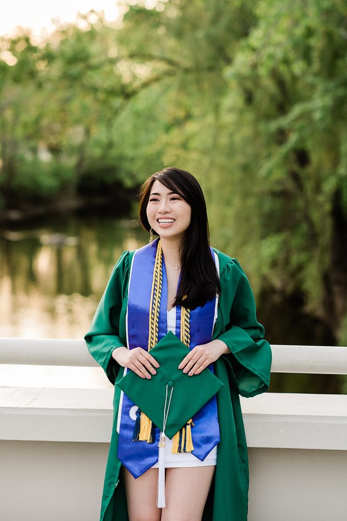 Michigan State Senior Graduation Pictures in cap and gown on campus; grad photos on the bridge overlooking the Red Cedar River by Allie Siarto & Co. Photography