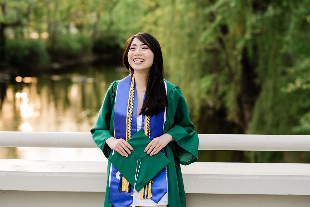 Michigan State Senior Graduation Pictures in cap and gown on campus; grad photos on the bridge overlooking the Red Cedar River by Allie Siarto & Co. Photography