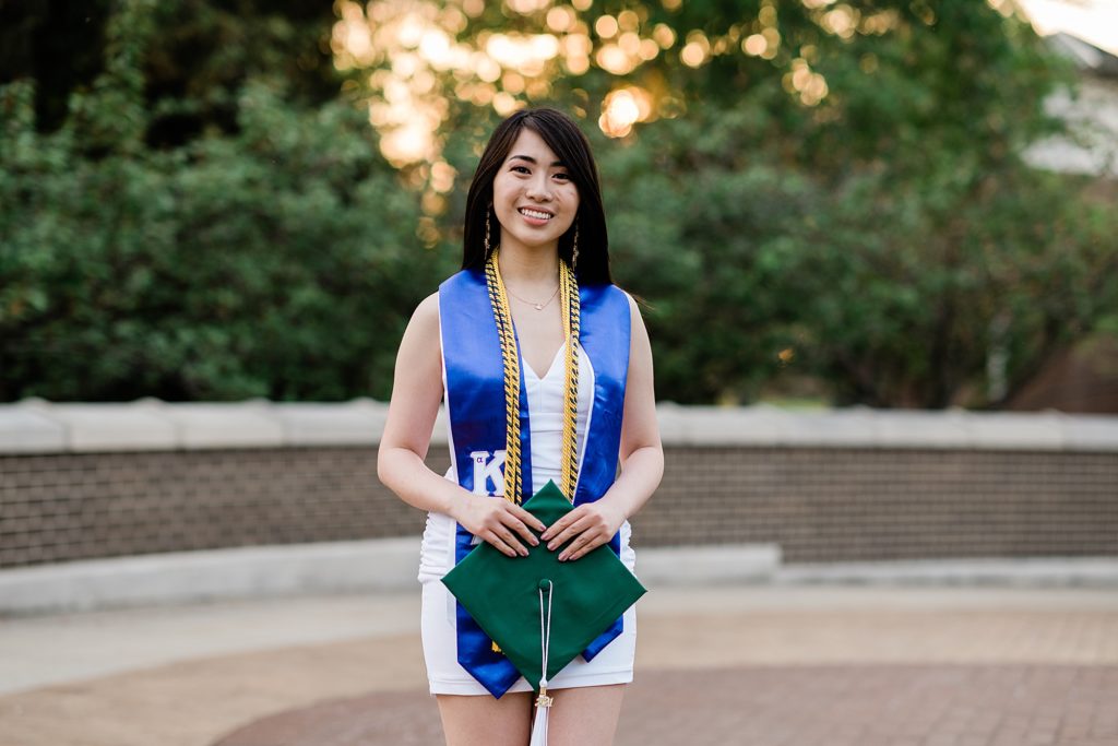 Michigan State Senior Graduation Pictures in cords and sash on campus; grad photos on the bridge over the Red Cedar River with Spartan Stadium in the background by Allie Siarto & Co. Photography