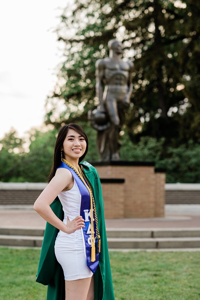 Michigan State Senior Graduation Pictures in gown over the shoulder on campus; grad photos in front of the Sparty Statue by Allie Siarto & Co. Photography