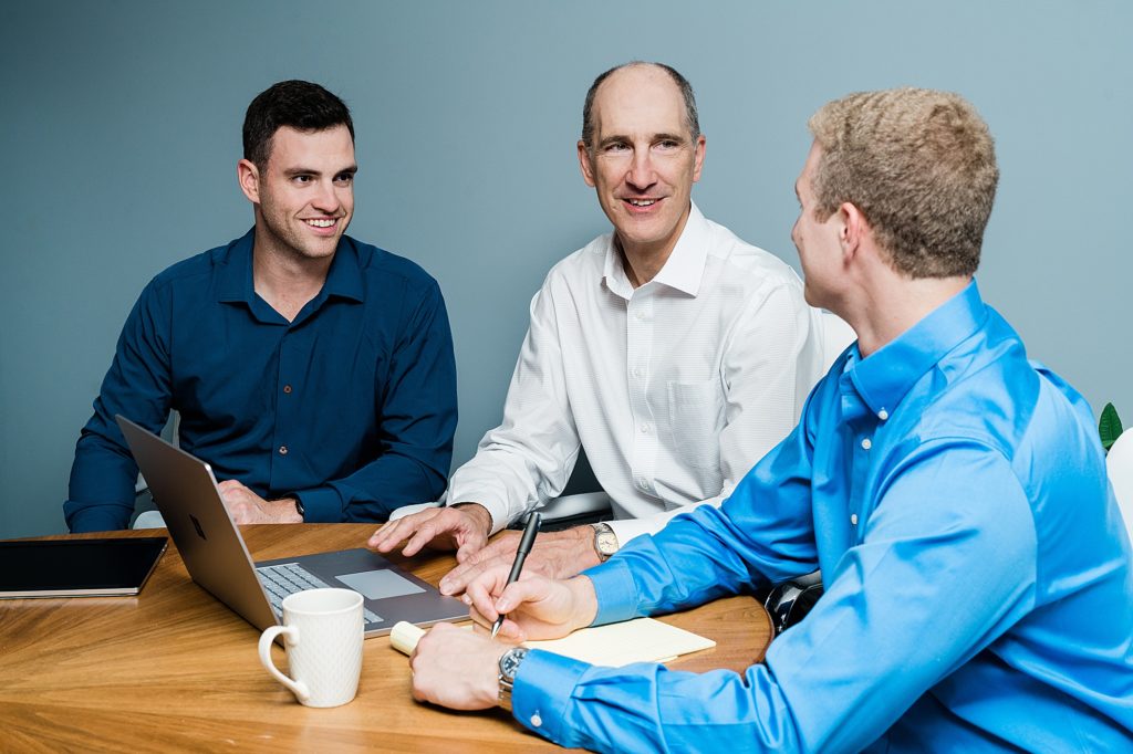 Lansing head shot photographer, photo of three men working together at the office, by Allie Siarto & Co. Photography, Michigan branding photographers