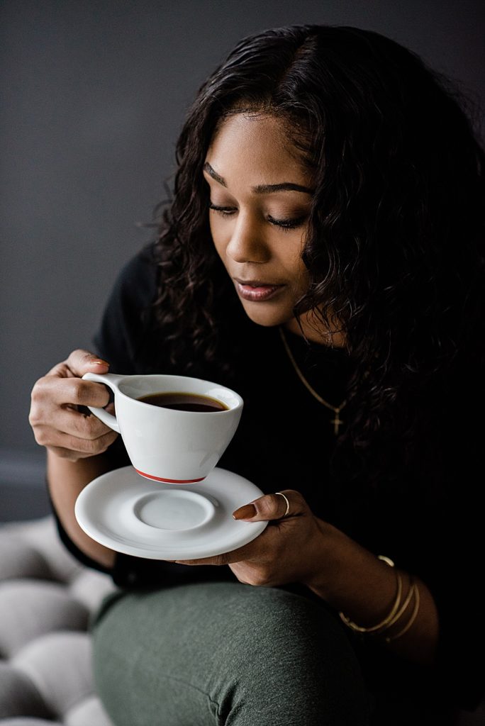 Lansing head shot photographer, photo of a woman looking at a cup of coffee while holding a saucer, by Allie Siarto & Co. Photography, Michigan branding photographers