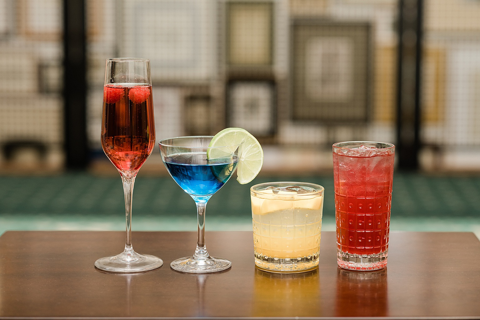East Lansing's Graduate Hotel School Spirits Dinner, photo of all drinks lined up on a table, by Allie Siarto & Co. Photography, Lansing commercial photographer