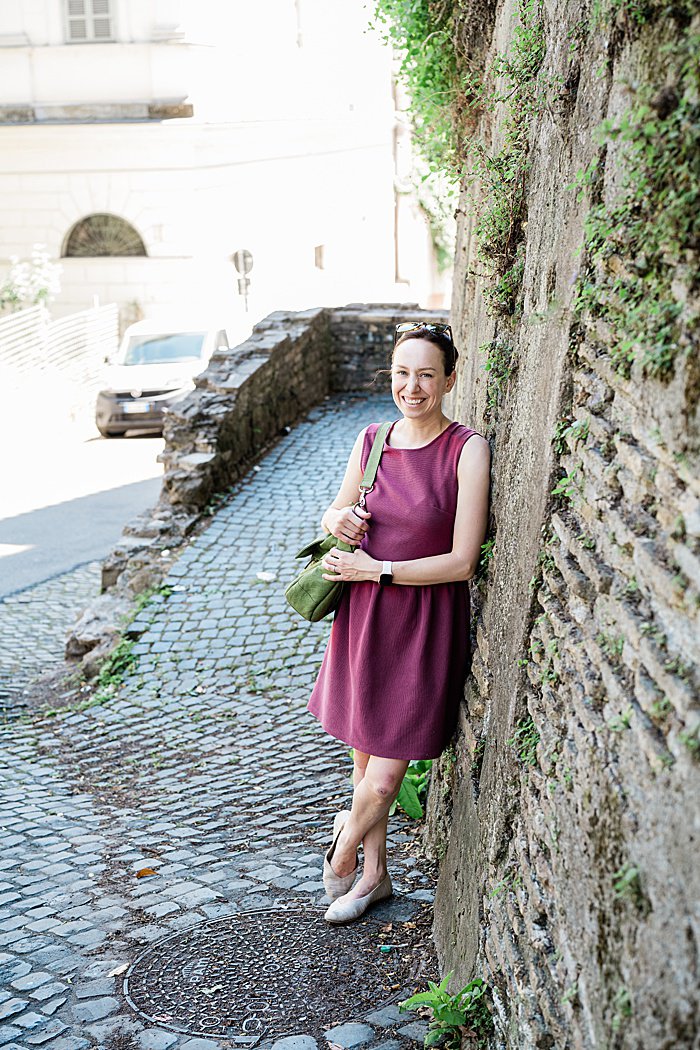 Michigan branding photographer in Rome - Allie leaning against an ancient brick wall