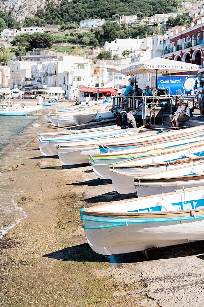 Michigan branding photographer in Rome - a row of canoes along the beach in Capri