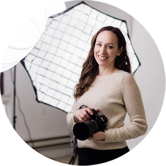 A photo of Allie Siarto, a branding, headshot, and product photographer, in her East Lansing, Michigan photography studio