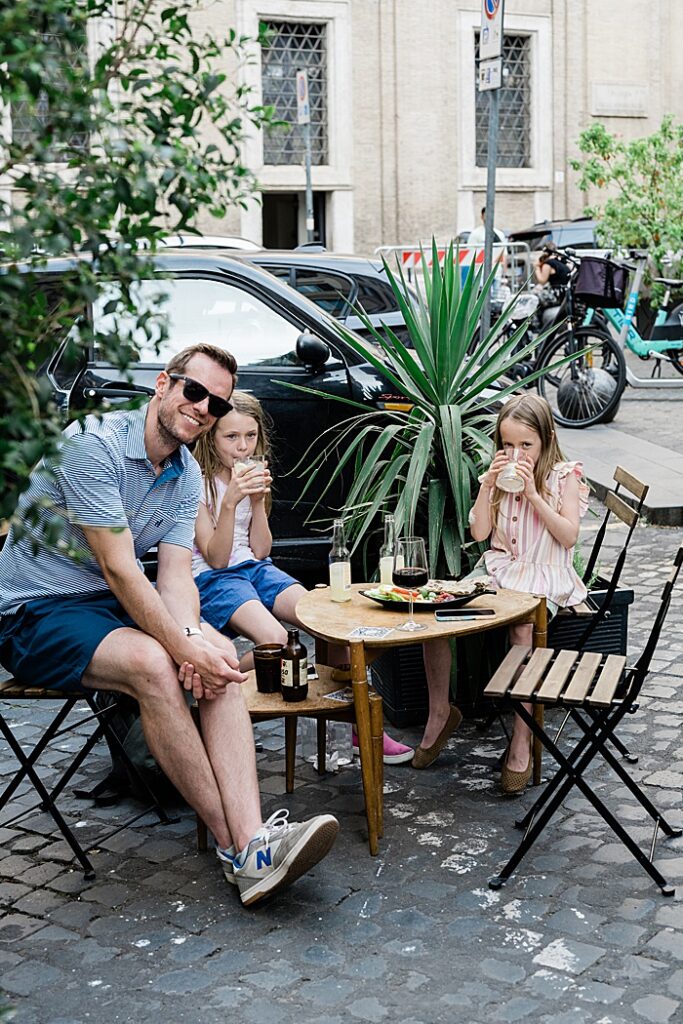 The kids enjoy pineapple juice during apertivo time in Rome, Italy