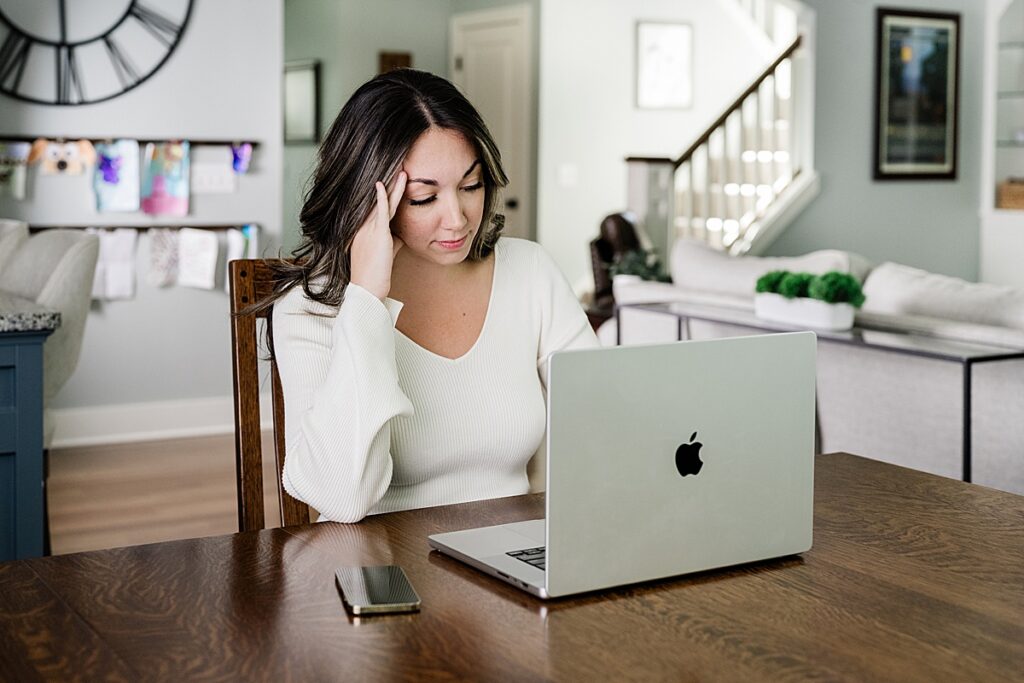 Photo of a woman stressed out on her laptop while working from home. Photo by Allie Siarto, Lansing, Michigan product photographer.