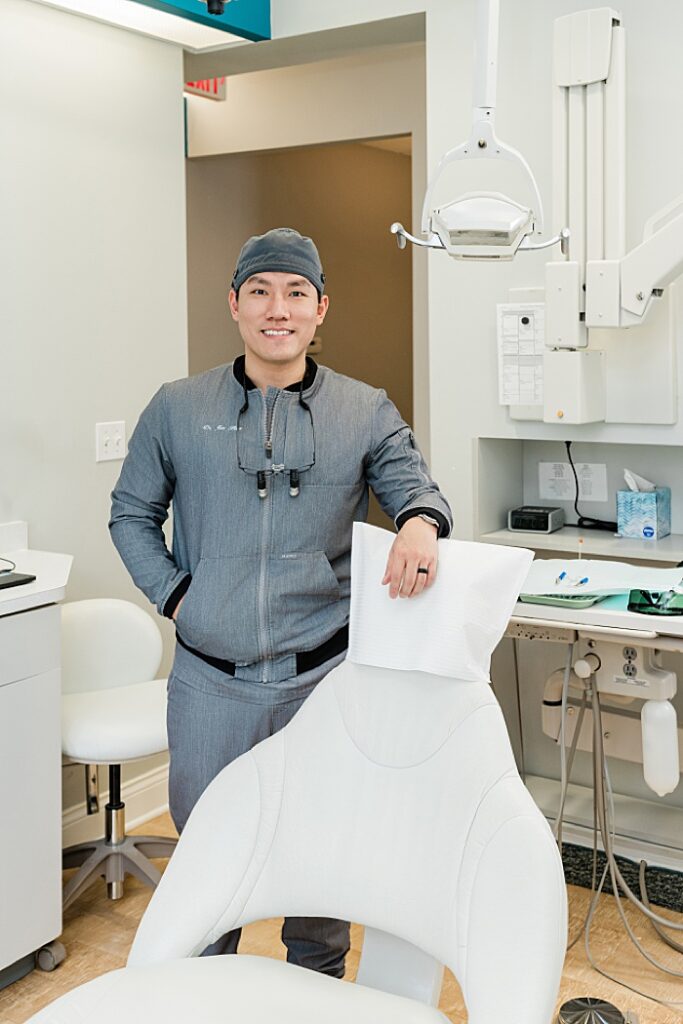 dentist marketing photos by Allie Siarto, Lansing, Michigan headshot and marketing photographer; a photo of a dentist standing at the dental chair