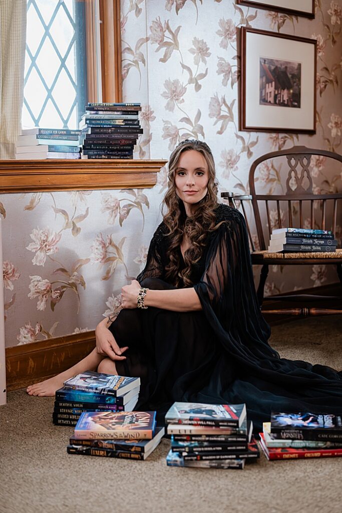 Creative head shots: Audio book narrator Bridgerton inspired headshots by Allie Siarto Photography, headshot and portrait photographer out of East Lansing, Michigan - an audiobook narrator sits among her books in a Victorian setting